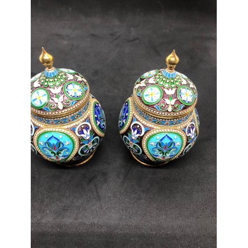 554 - A PAIR of Russian silver enamel lidded urn/caddys Height 10.6cm Diameter 6.6cm Weight 295 for the pa... 