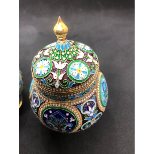 554 - A PAIR of Russian silver enamel lidded urn/caddys Height 10.6cm Diameter 6.6cm Weight 295 for the pa... 