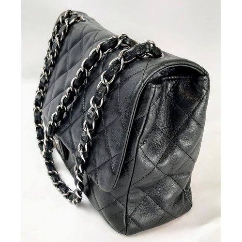 64 - The Classic Chanel Lambskin Flap Bag. Features the Mademoiselle lock, double chain shoulder strap. Q... 