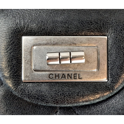 64 - The Classic Chanel Lambskin Flap Bag. Features the Mademoiselle lock, double chain shoulder strap. Q... 