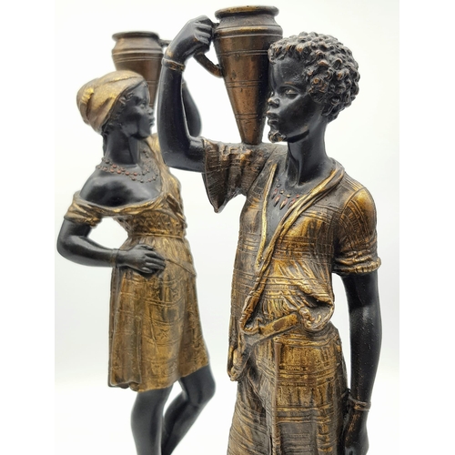 632 - An antique pair of 19th century Louis Hottot blackamoor bronze candlesticks. 36 and 37cm tall. Total... 