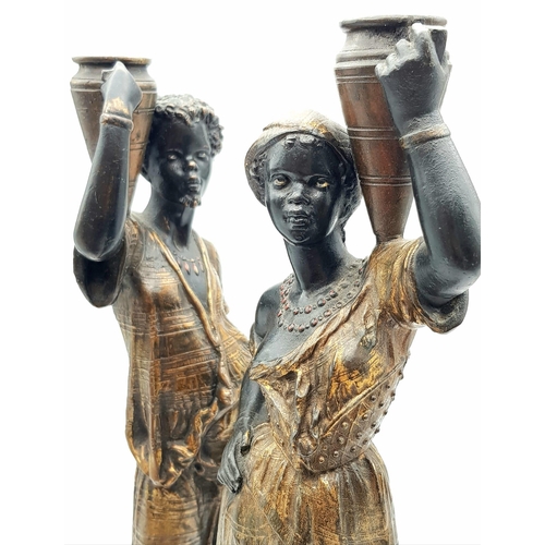 632 - An antique pair of 19th century Louis Hottot blackamoor bronze candlesticks. 36 and 37cm tall. Total... 