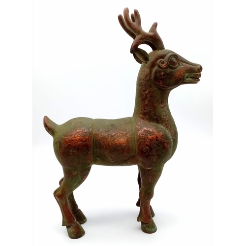 633 - An antique bronze Chinese stag/deer figure. 30cm height. 21cm length. 9cm width. 1418 grams. Small d... 