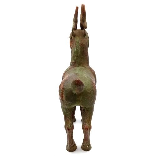 633 - An antique bronze Chinese stag/deer figure. 30cm height. 21cm length. 9cm width. 1418 grams. Small d... 