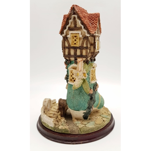 955 - There was an Old Woman that Lived in a Shoe Decorative Piece. On wooden stand. 18 x 25cm.