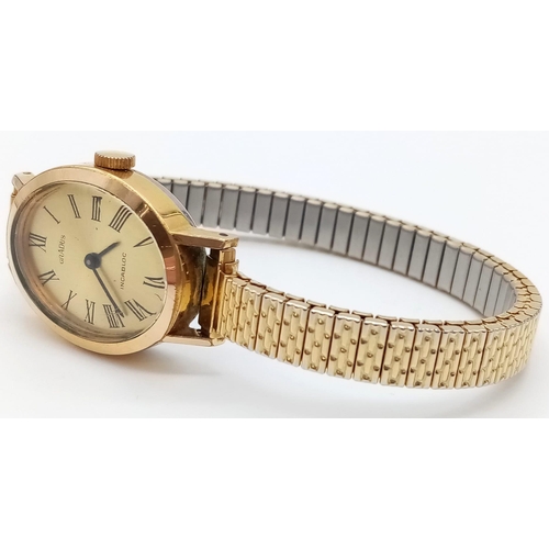 947 - A gold plated Gradus ladies mechanical watch with expandable strap. 20mm.