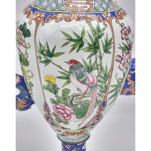 613 - An antique Chinese enamel large coffee pot. 28cm tall. 26cm wide.