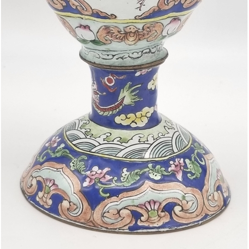 613 - An antique Chinese enamel large coffee pot. 28cm tall. 26cm wide.