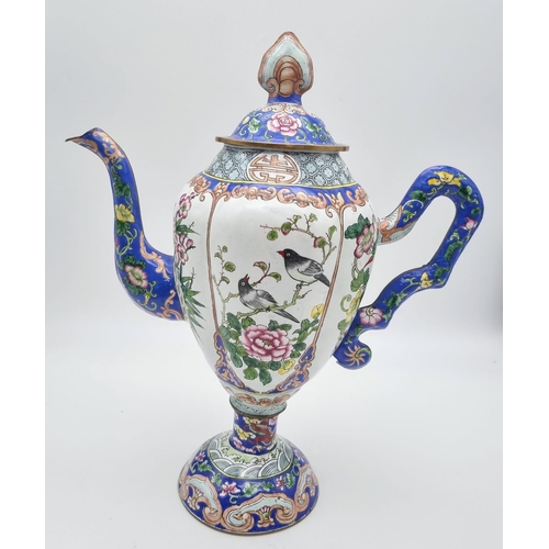 613 - An antique Chinese enamel large coffee pot. 28cm tall. 26cm wide.