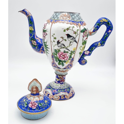 613 - An antique Chinese enamel large coffee pot. 28cm tall. 26cm wide.