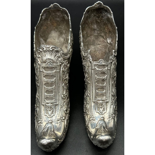 662 - An early Victorian pair of white metal shoes. Total weight: 706 grams.  19cm length. 10cm tall.