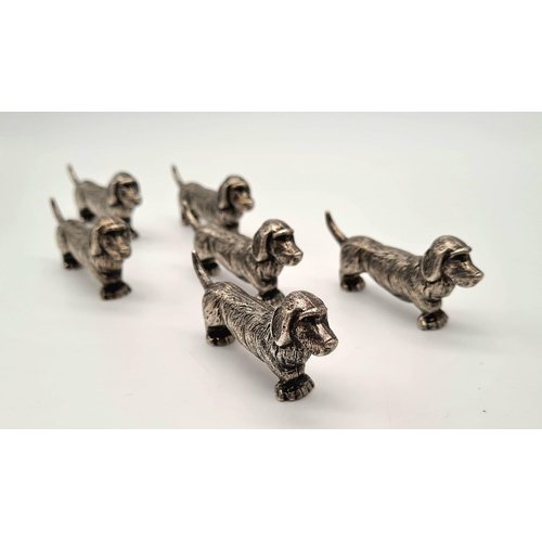 634 - Six white metal dog dachshund knife rests. Comes in a wooden oriental box. Metal dog - 49 grams each... 