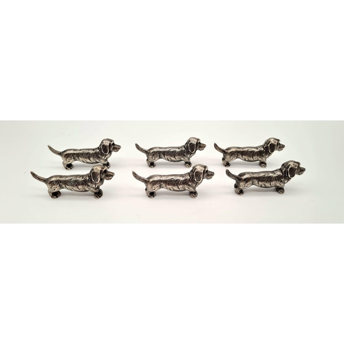 634 - Six white metal dog dachshund knife rests. Comes in a wooden oriental box. Metal dog - 49 grams each... 