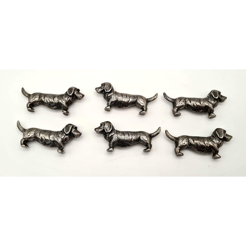 634 - Six white metal dog dachshund knife rests. Comes in a wooden oriental box. Metal dog - 49 grams each... 