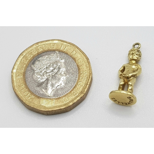 398 - 18k Yellow Gold Peeing Boy Charm. 19mm in length, 2.5 grams total weight