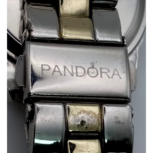 513 - A PANDORA stainless steel watch. Case width: 36 mm, mother of pearl dial with date window. In full w... 