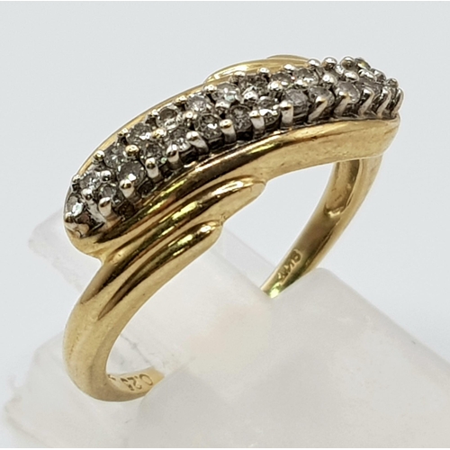 52 - A 9 K yellow gold ring with a double diamond (0.25 carats) twist. Ring size: N1/2, weight: 3.1 g.