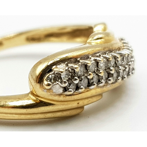 52 - A 9 K yellow gold ring with a double diamond (0.25 carats) twist. Ring size: N1/2, weight: 3.1 g.