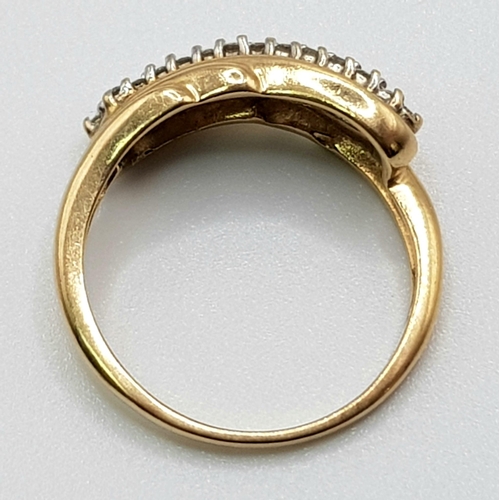 52 - A 9 K yellow gold ring with a double diamond (0.25 carats) twist. Ring size: N1/2, weight: 3.1 g.