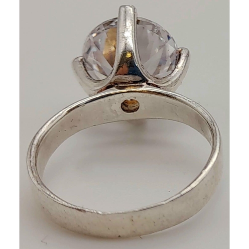 87 - An impressive sterling silver solitaire ring with a large cubic zirconium, ring size: M, AND a chain... 