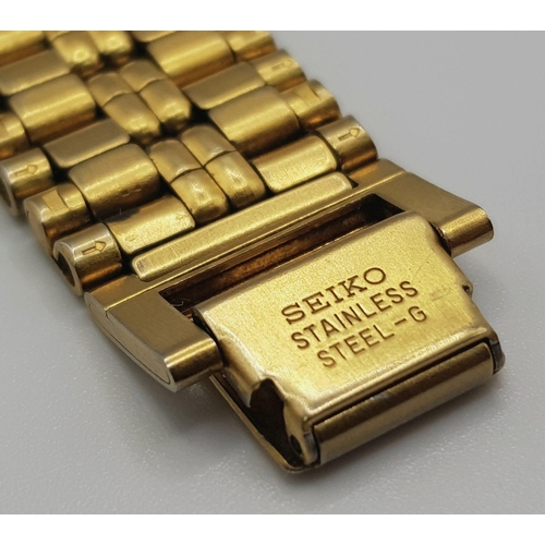 223 - A yellow gold plated SEIKO gents watch. Case width: 33 mm, white dial with black Roman numerals and ... 