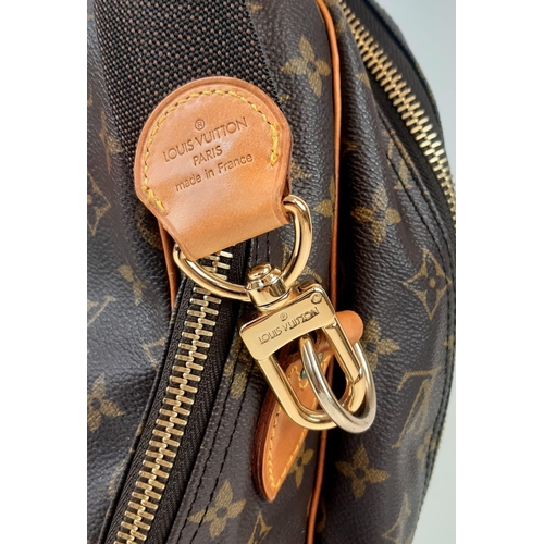 265 - A Louis Vuitton Monogram Alize 24Hr Boston Bag. Shoulder strap. Brown leather handles. Cloth interio... 