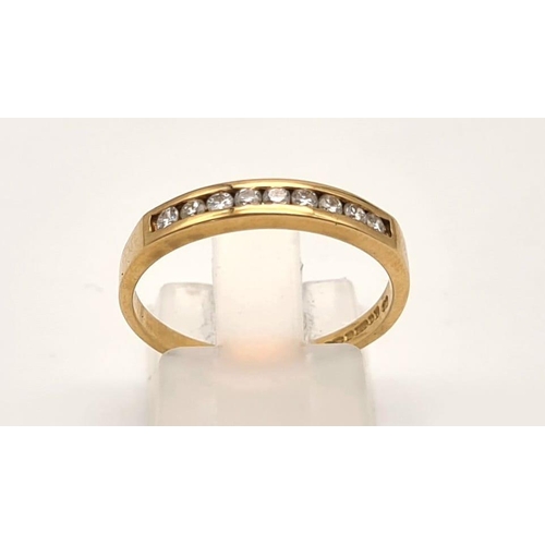 295 - An 18 K yellow gold CHANNEL ring with a band of 9 diamonds (0.25 carats). Ring size: O, weight: 2.5 ... 