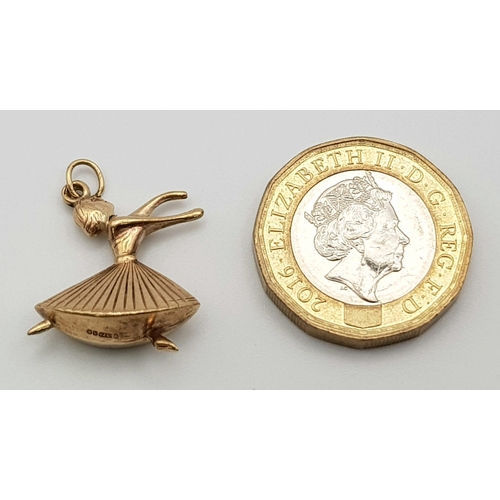 440 - 9k yellow gold charm/pendant of a dancing lady. 19mm in length, total weight 1.2 grams