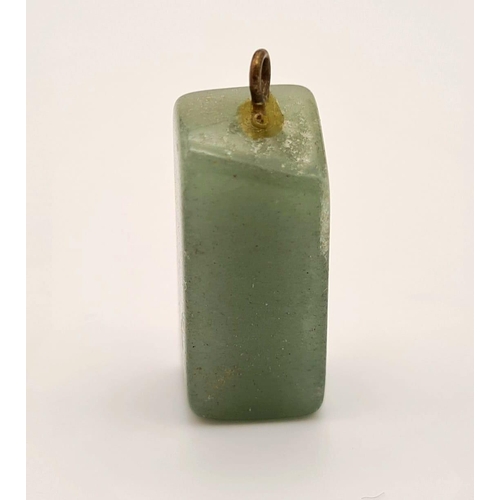 474 - A rectangular shaped jade pendant. Drop: 20 mm.