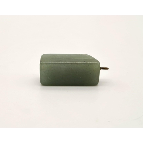 474 - A rectangular shaped jade pendant. Drop: 20 mm.