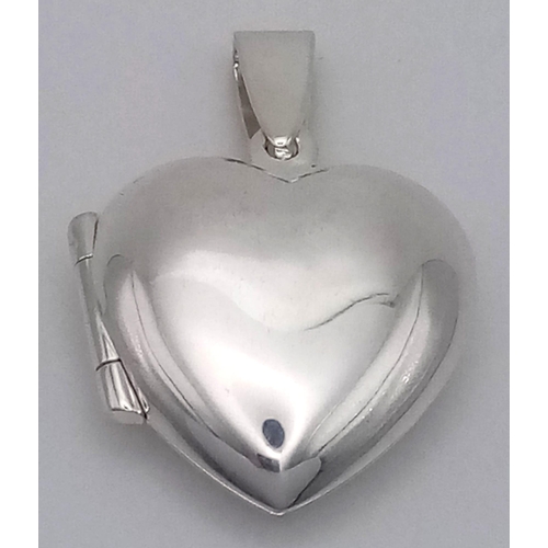 549 - Sterling silver heart locket, 30mm in length, total weight 3.6 grams