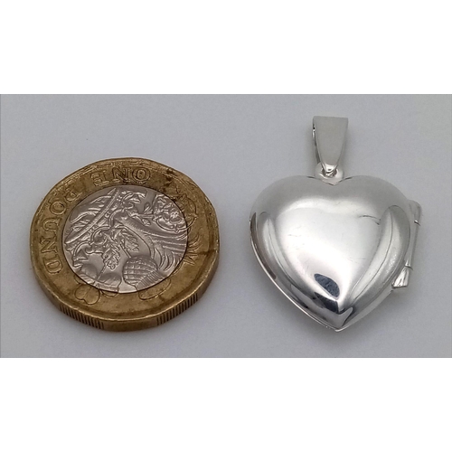 549 - Sterling silver heart locket, 30mm in length, total weight 3.6 grams