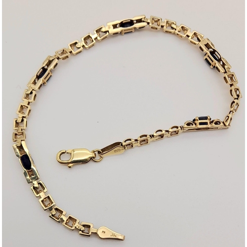 608 - 9k yellow gold diamond and sapphire bracelet. 19cm in length, 4.4 grams total weight