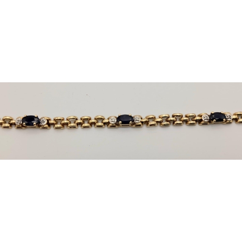 608 - 9k yellow gold diamond and sapphire bracelet. 19cm in length, 4.4 grams total weight