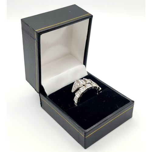 82 - A Bvlgari 18K White Gold Diamond Serpent Ring. In a tribute to a spirit animal , Bulgari captures th... 