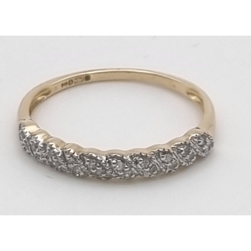 775 - 9K YELLOW GOLD DIAMOND BAND RING 1.5G 0.10CT SIZE R.