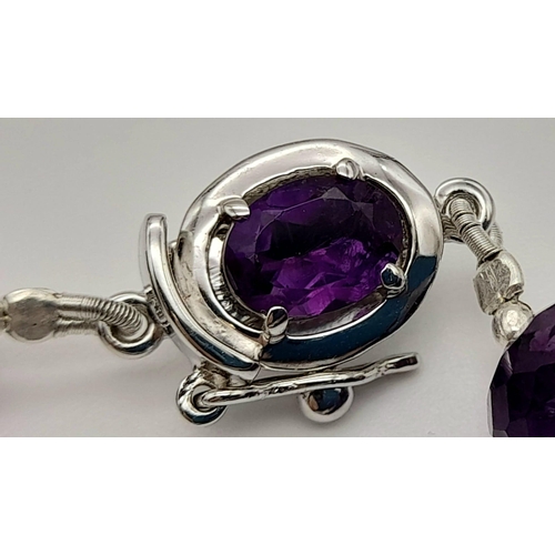 477 - A 355ct Amethyst and Citrine Gemstone Necklace, 18 inches with Amethyst Clasp in 925 Silver.