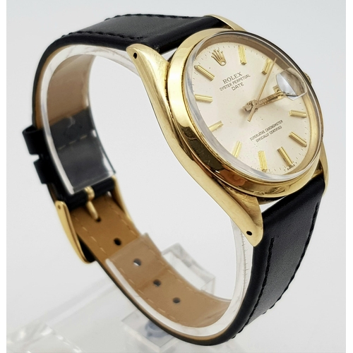 719 - A Rolex Oyster Perpetual Gold Cased Gents Watch. Black leather strap. 14K gold case - 35mm. White di... 