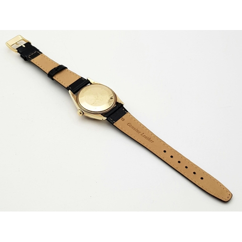 719 - A Rolex Oyster Perpetual Gold Cased Gents Watch. Black leather strap. 14K gold case - 35mm. White di... 