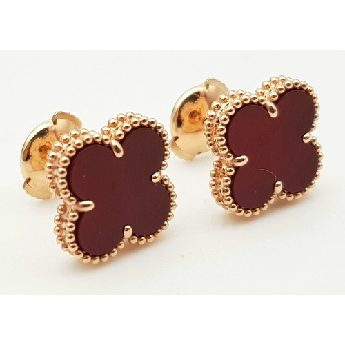 96 - A Pair of Van Cleef and Arpels 18K Rose Gold and Cornelian Alhambra Earrings. Light and delicate, th... 