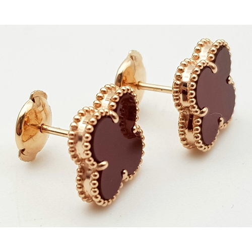 96 - A Pair of Van Cleef and Arpels 18K Rose Gold and Cornelian Alhambra Earrings. Light and delicate, th... 