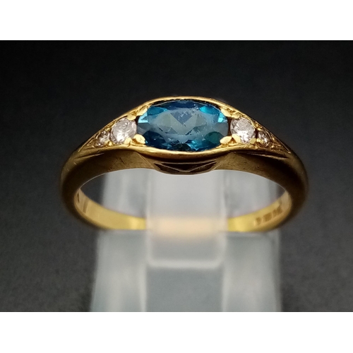 600 - An 18K Yellow Gold Ceylon Pale Blue Sapphire Diamond Ring. Central sapphire with two graduated round... 