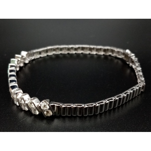 696 - A Beautiful 2.75ct Diamond Bracelet set in 18K White Gold with two figure of eight safety catches. 9... 