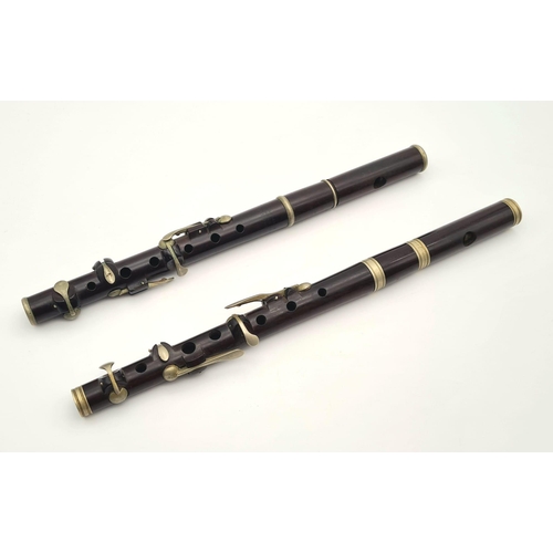 989 - A Pair of Late 19th Century Six-Key Flutes. One made by J. Wallis and Sons of London - has a small s... 