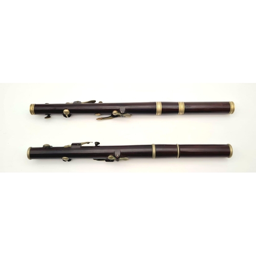 989 - A Pair of Late 19th Century Six-Key Flutes. One made by J. Wallis and Sons of London - has a small s... 