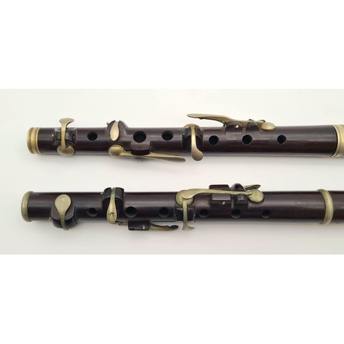 989 - A Pair of Late 19th Century Six-Key Flutes. One made by J. Wallis and Sons of London - has a small s... 