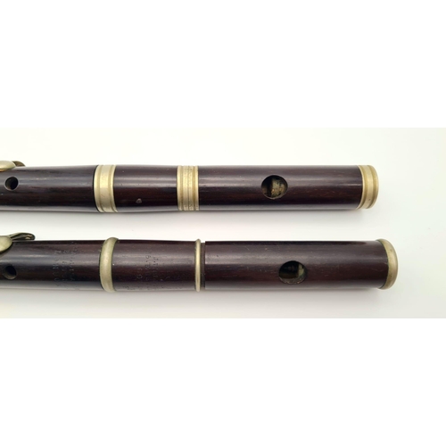 989 - A Pair of Late 19th Century Six-Key Flutes. One made by J. Wallis and Sons of London - has a small s... 