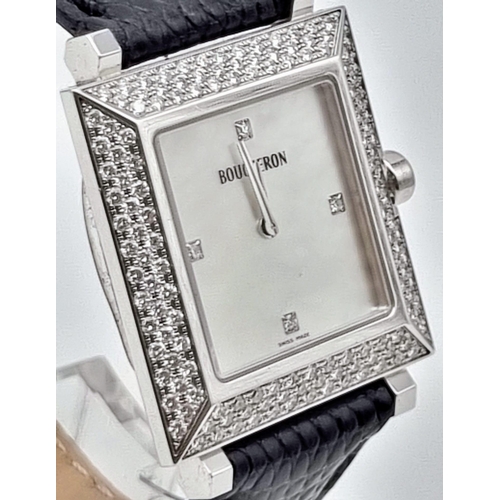 81 - A Boucheron 18K Gold and Diamond Ladies Watch. Black leather strap. Gold and diamond rectangular cas... 