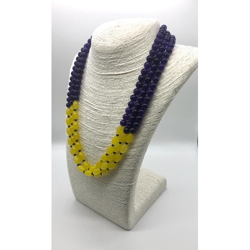 166 - A Dazzling Three-Strand Amethyst and Yellow Onyx Beaded Necklace. Round and oval beads. 46 - 52cm.