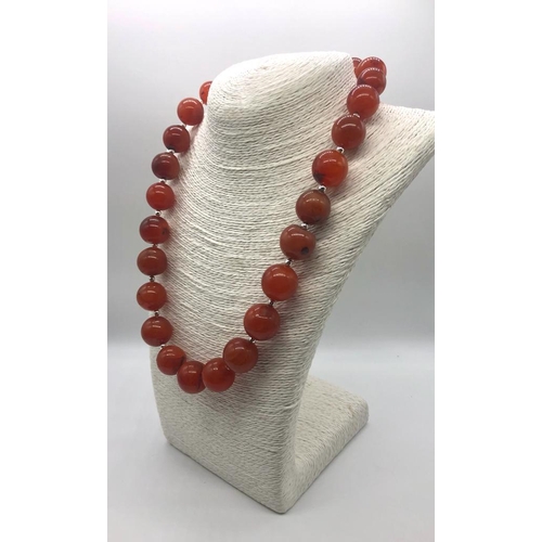 293 - An Autumn Fire Graduated Agate Bead Necklace. Largest bead 20mm.